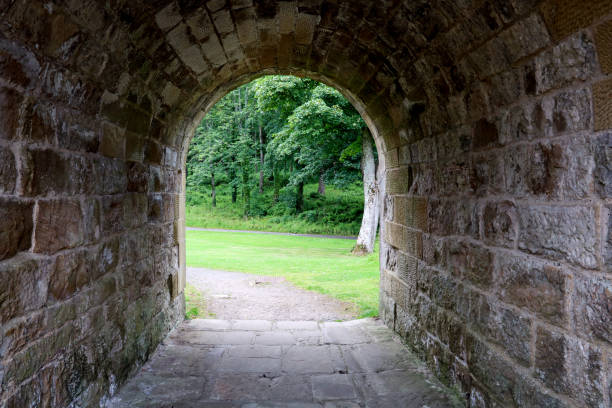 istock View Through Old Stone Underpass in a Country Estate 1253239124