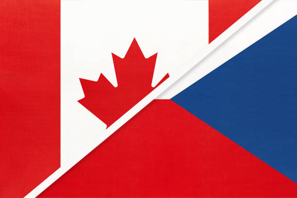 istock Canada and Czech Republic, symbol of national flags from textile. Championship between two countries. 1253239384