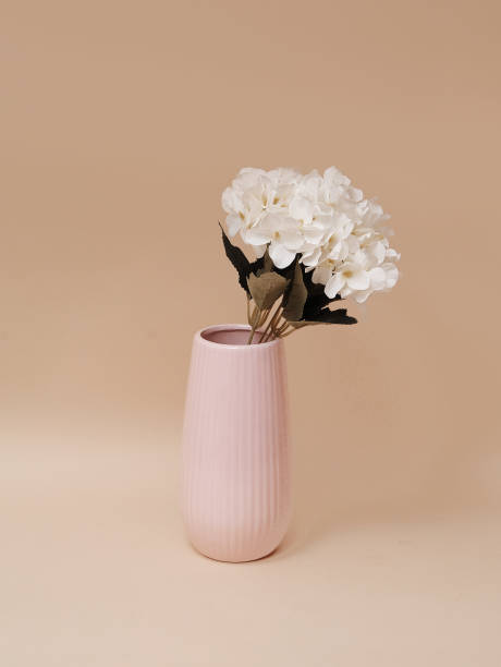 istock artificial flowers in decorative vase on beige background 1253242031