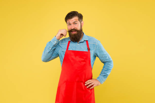 istock Hipster style. Inspired for changes. Man brutal bearded hipster with mustache wear apron. Barbershop staff. Beard grooming salon. Well groomed macho barber. Barbershop concept. Hairdresser barber 1253243729