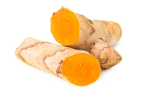 istock Turmeric root with turmeric slices isolated on white background 1253246659