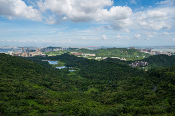 istock Mountain climbing overlooking the city 1253246747