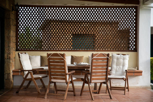istock Wooden Table and Comfortable Chairs on a Porch 1253248082