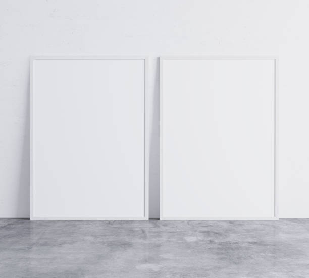 istock Set of 2 white vertical modern frames. Frame mock up on white wall. Minimal design. Stock photo 1253249353
