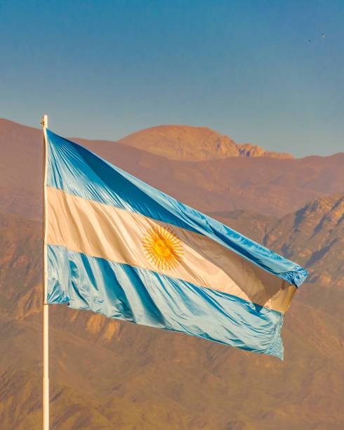istock Argentina Flag Over Mountains Background, Mendoza, Argentina 1253249857