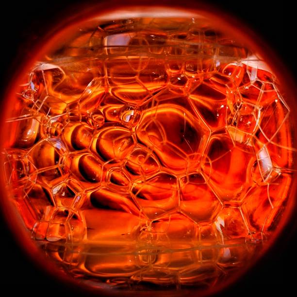 istock Red coloured soap foam macro photography 1253251110