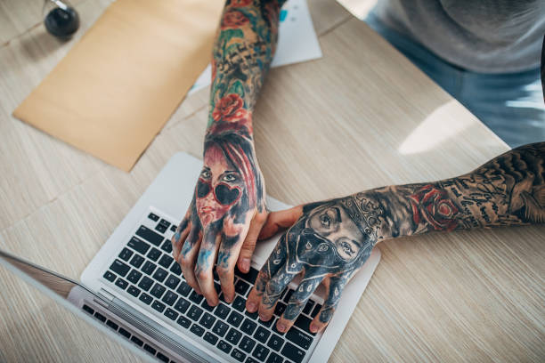 istock One young tattooed man working from home 1253253561