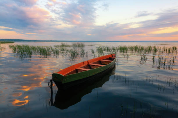 istock Wooden boat on the lake 1253255045