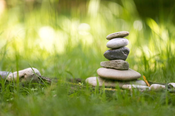 istock Spirituality: Stone cairn in the park. Balance and relaxation. 1253256105