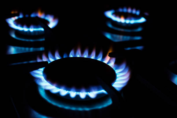 istock Kitchen burner flaming in the dark 1253257915