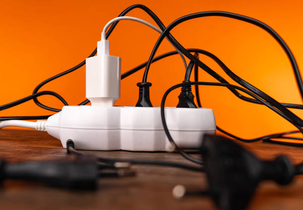 istock White extension cord with three plugs on orange background 1253258012
