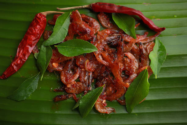 istock Fried dried chili prawns served on a banana leaf 1253258013