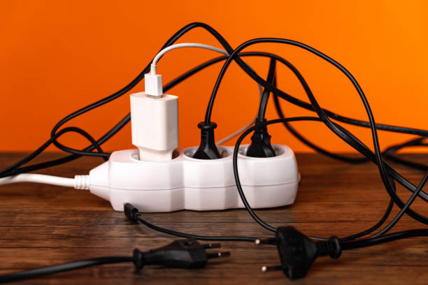 istock White extension cord with three plugs on orange background 1253258664