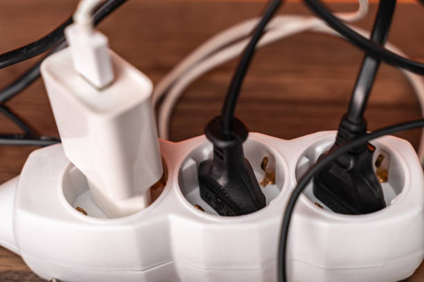 istock White extension cord with three plugs on orange background 1253258736
