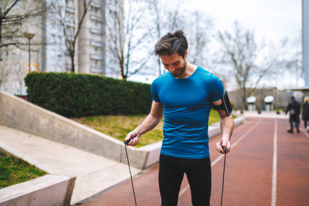 istock Fitnes outdoors - jumping rope 1253260542