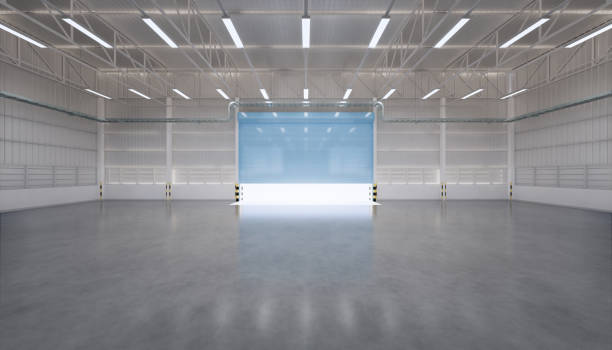 istock 3d rendering of empty hangar and concrete floor and shutter door, clean and new condition. 1253261443