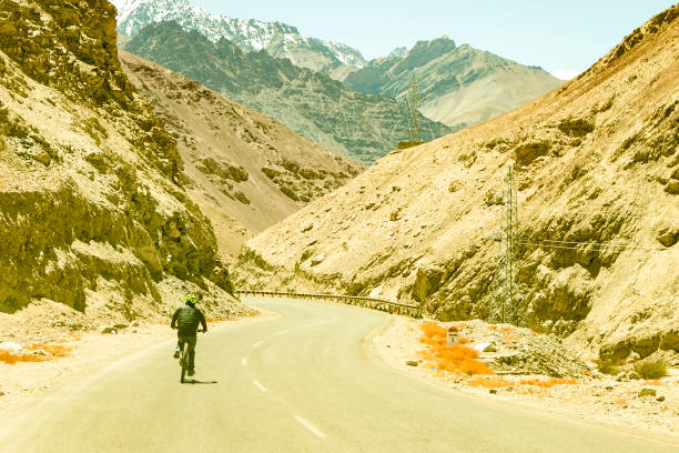 Motorcycle is parked by the side of the mountain road. Moto Traveling in Portugal.