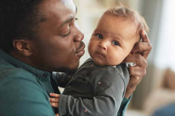 istock Loving Father Kissing Baby 1253263988