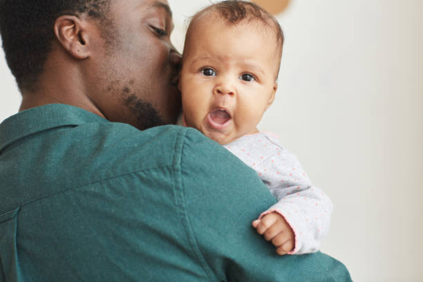 istock African Father Holding Baby 1253264031