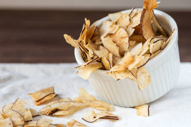 istock Delicious crispy coconut chips with salted caramel. Natural product made from coconut pulp. 1253267196