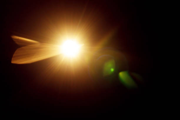 istock Easy to add lens flare effects for overlay designs or screen blending mode to make high-quality images. Abstract sun burst, digital flare, iridescent glare over black background. Defocused bokeh. 1253269670