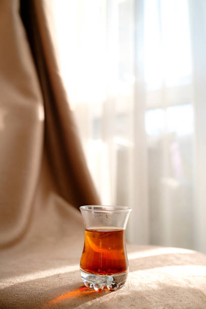 istock traditional turkish tea cup on fabric background 1253270058