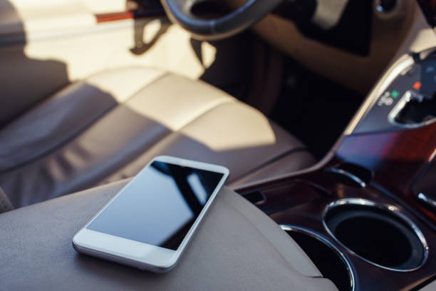 smart phone phone on the car seat dashboard. Lifestyles photo in car. Different views. Without hand, phone.