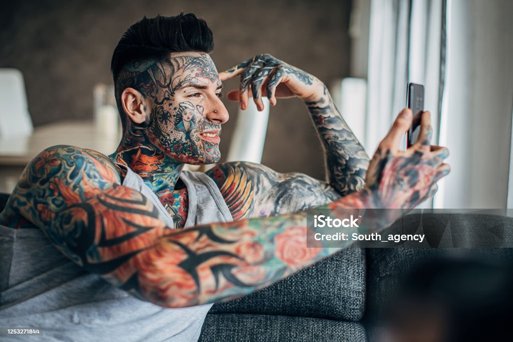 Handsome Man With Whole Body Covered In Tattoos Using Smart Phone At Home  Stock Photo - Download Image Now - iStock