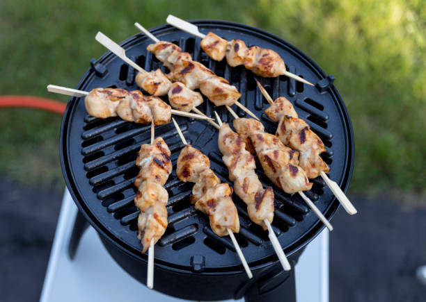 istock busy with grilling a chicken sate on a bbq 1253272480