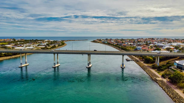 Dawesville Channel is an artificial channel between the Peel-Harvey Estuary and the Indian Ocean at Dawesville. Dawesville Channel is an artificial channel between the Peel-Harvey Estuary and the Indian Ocean at Dawesville, about 80 km south of Perth tidal inlet stock pictures, royalty-free photos & images