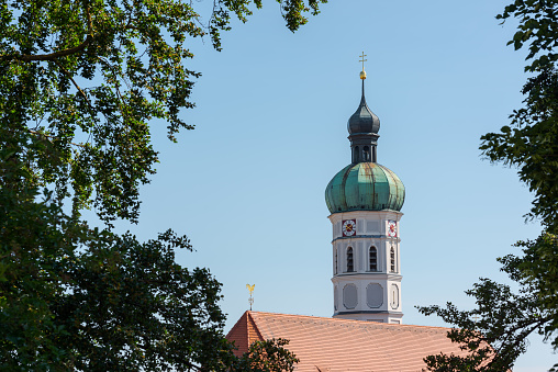 City of Dachau in Upper Bavaria, tower of the church of St. Jakob, blue sky in summer
