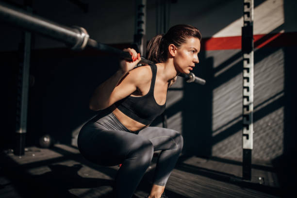 istock Young fit woman training in the gym 1253275989