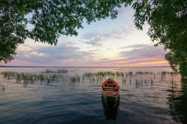 istock Wooden boat on the lake 1253276414