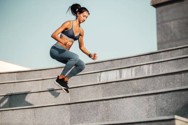 istock Young woman exercising outdoor 1253278164