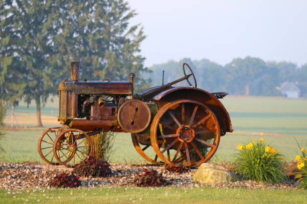 istock rusty vintage farm tractor display rural farm bright flowers 1253279687