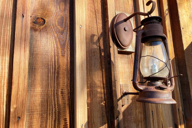 istock gas lantern hanging old log cabin shed building 1253279727