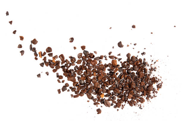 istock Coffee bean craked crushed splash isolated on white background top view 1253282434