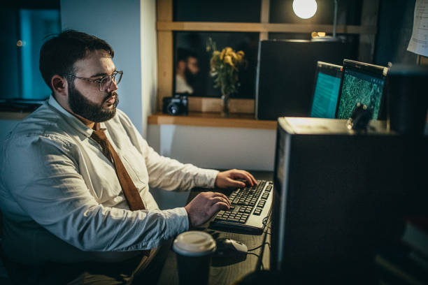 istock Young detective working late on a case in the office 1253283736