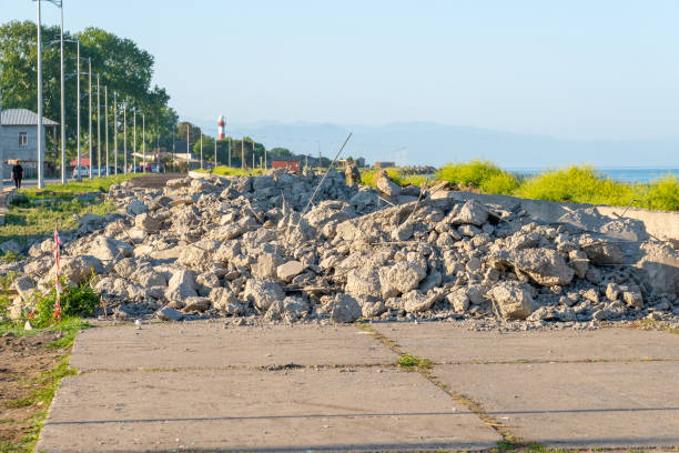 istock Drilled surface with jackhammer. Concrete broken from excavator drilling 1253284078