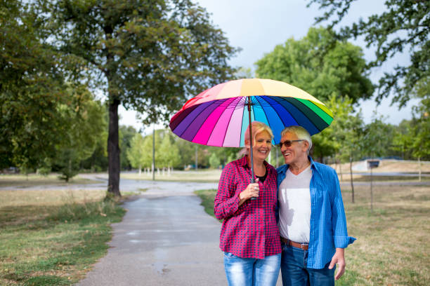 istock Couple walking in wet day 1253287323