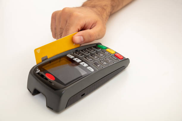 istock Payment machine, POS terminal and credit card isolated on white background. 1253287717