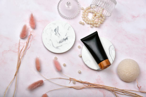 istock Cosmetic bottle containers on pink marble background, Blank label package for branding mock-up, Natural organic beauty product concept, Research and development of purified skincare. 1253287749