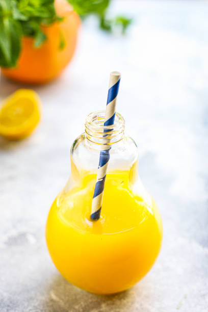 istock orange juice or lemonade with mint or lemonade with mint  transparent glass cup with mint takeaway drink Menu concept serving size food background top view copy space for text organic healthy eating 1253288737
