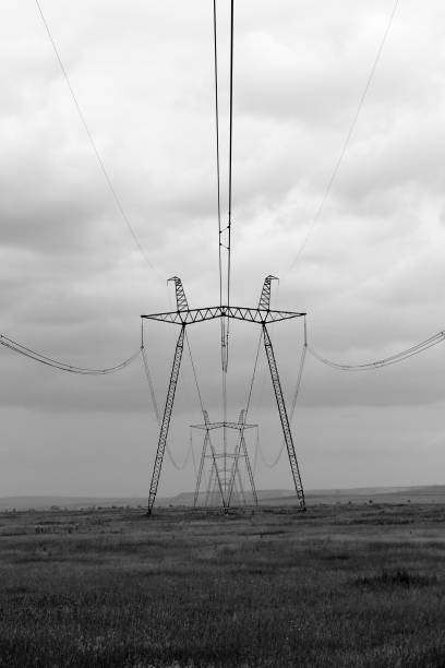 istock High voltage transmission tower in field 1253289465