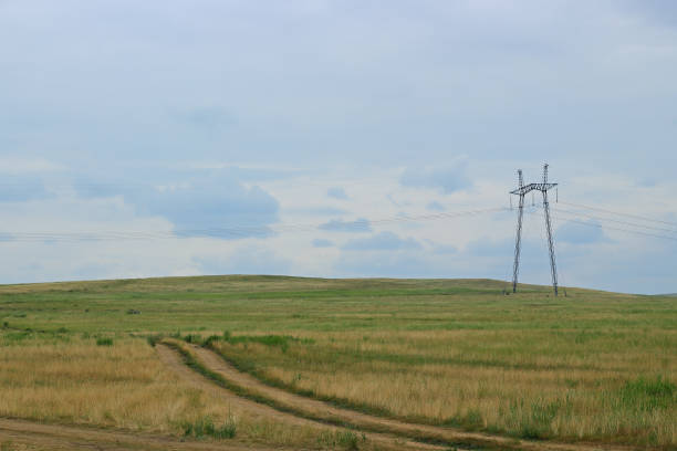 istock High voltage transmission tower in field 1253289487