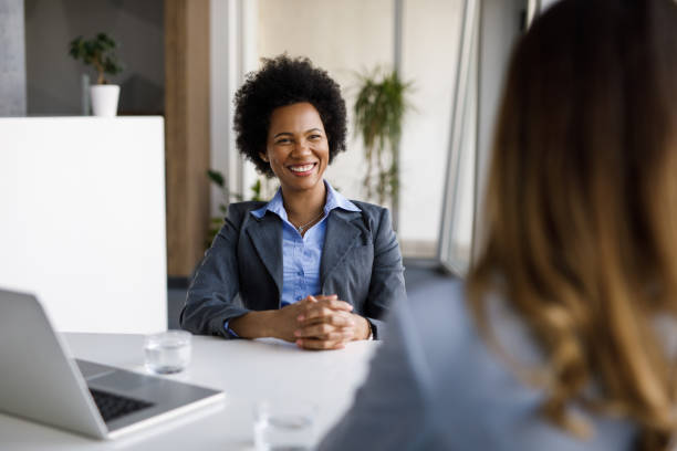 istock Two diverse businesswomen talking, working together in office 1253290848