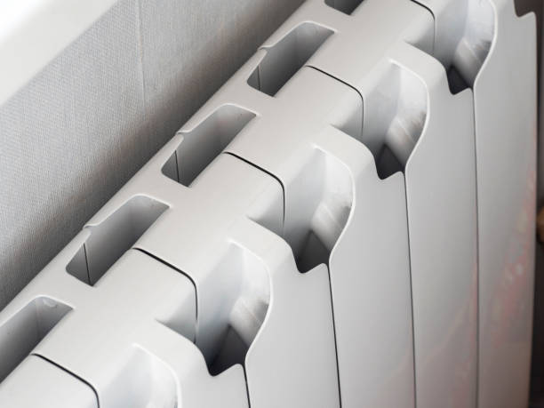 istock a bimetallic radiator is installed under the window in the room. Modern solutions for Central heating of rooms that retain heat and allow you to save money 1253293424