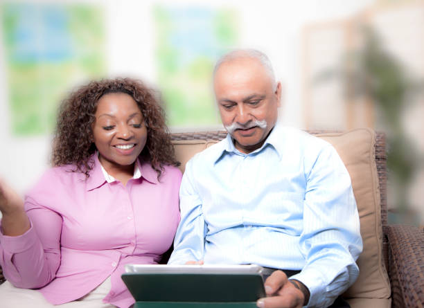 istock Relationships:  couple at home on couch 1253294748