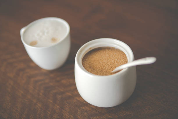 istock cappuccino next to sugar bowl 1253295747