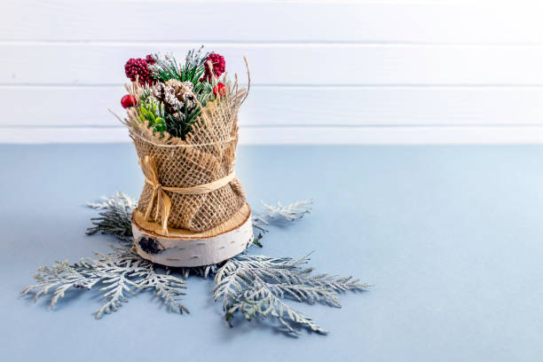 istock Top view on Christmas decoration, green thuja branches on blue background. 1253298992
